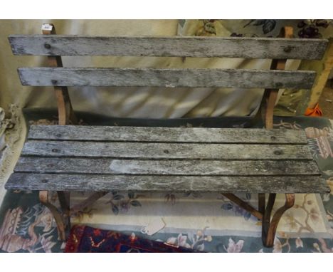 A Vintage wooden slated garden bench.