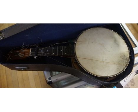 A John Grey & Son vintage ukulele with assorted music sheets, original carrying case. 