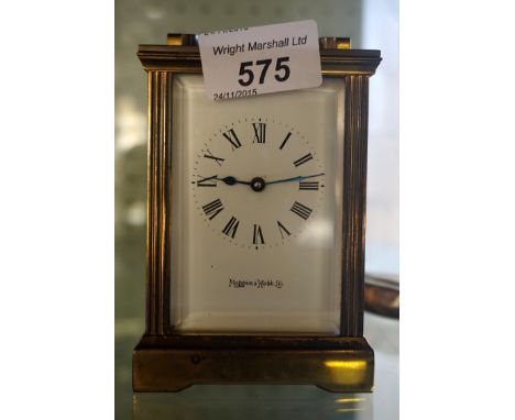 A Mappin & Webb brass bound rectangular carriage clock, with key.