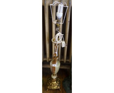 A reproduction onyx table lamp, raised on brass base.