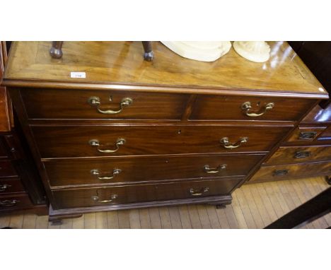 A Victorian mahogany breakfront chest of two short over three long drawers, raised on bracket supports.