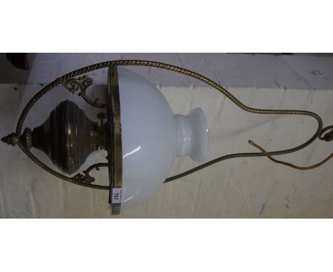 A good quality mid 20th Century brass hanging paraffin lamp, with milk glass shade