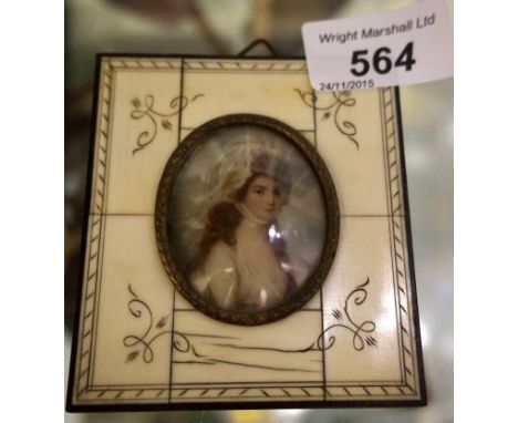 A hand painted oval portrait miniature on ivory, signed H Ford, set within a piano key rectangular frame. 