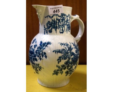 A Worcester 18th Century Cabbage mask jug with scrolling loop handle and floral painted decoration (af).