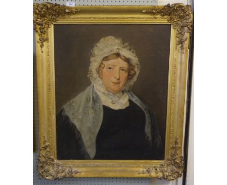An early 19th Century oil on canvas, depicting a portrait of a lady wearing a fine lace hat, inset in ornate gilt frame.