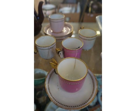 An unusual Royal Worcester pink ground tea set comprising six saucers and five cups with butterfly ceramic handles 