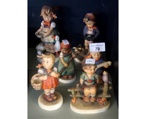 A collection of six Goebel Hummel figurines to include a girl feeding ducks, a boy with pigs, a girl playing a musical instru