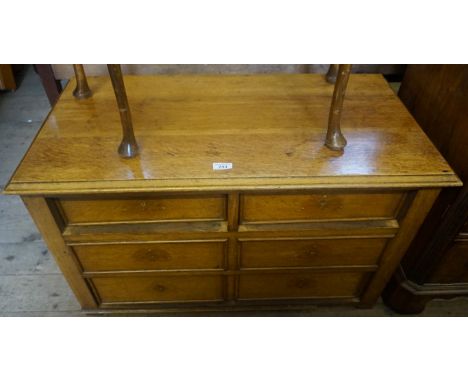 A mid 20th Century light oak office chest of six drawers.
