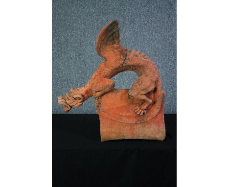Terracotta dragon. A copy of a Chinese roof tile. Twentieth century. H.67 W.62 cm. (Old repair to neck). 