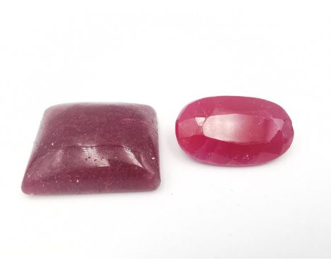 Two loose treated rubies, one oval mixed cut with an approximate carat weight of 23.46 carats (chip to one end, glass filled)