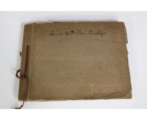 An early 20th century photo album of fifteen images taken at a Persian art exhibition. H.19 W.25 cm. 