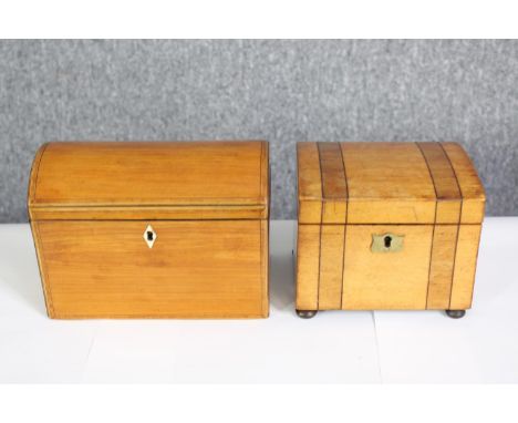 An early 19th century satinwood and crossbanded tea caddy and a similar mid 19th century box. H.14 W.19 D.11cm. 