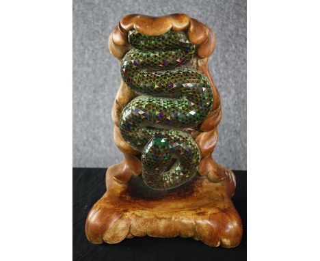 A ceramic and mirrored mosaic wall mounted plant shelf with sculpted green serpent adorned with green and red mirrored glass 