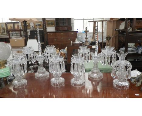 A pair of Waterford crystal candelabra and four candlesticks with cup prismatic drops, the candelabra, 20" high, candlesticks
