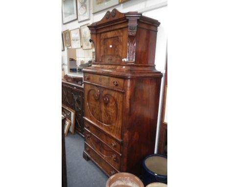 An early 19th century Continental figured mahogany "secrétaire à abattant" with fully fitted architectural interior 