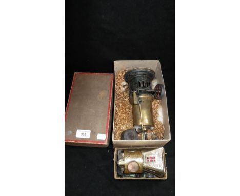 A German upright model steam engine in original box and other items