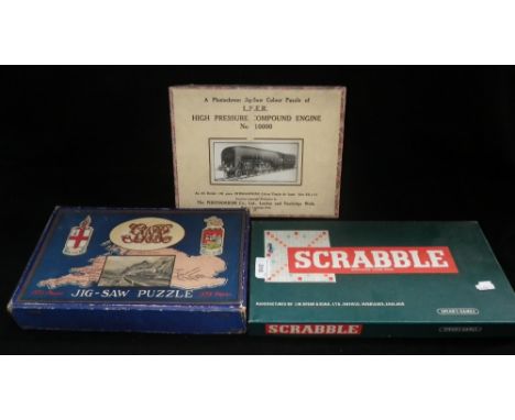 A photochrome jig-saw puzzle of an Lner engine, in original box, another similar and Scrabble set