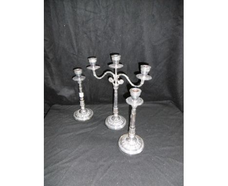 A plated candelabra and matching pair of candlesticks