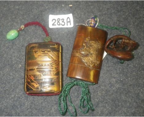 Two Japanese wooden Inro , one with a Netsuke