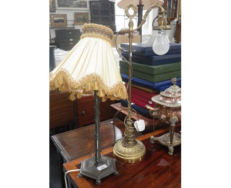 A late 19th early 20th century gilt brass table lamp with adjustable light and one other electroplated table lamp, 25" and 16