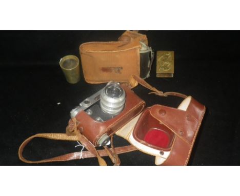 A folding camera in case and other assorted items