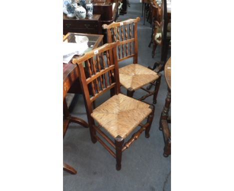 A set of six Lancashire type bobbin-back rush seated dining chairs, including a single armchair