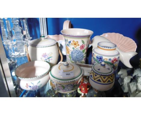 A collection of Poole pottery including a Carter, Stabler & Adams, lidded pot