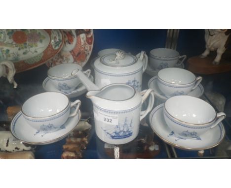 A Spode teapot, jug and six cups and saucers decorated with 'Trade Winds' blue pattern