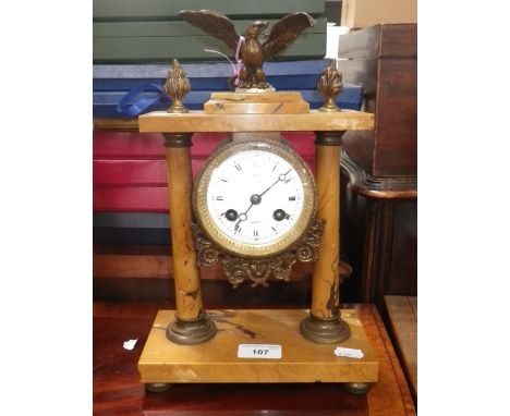 A 19th century French marble mantel clock with a brass eagle finial, 12.5" high