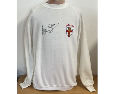 Football Legend, Alan Ball signed white England jumper. This size Large, lovely jumper has an England emblem stitched onto it