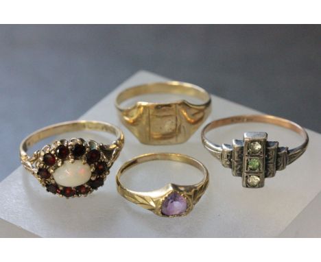 Four vintage gold rings, one with opal and garnets