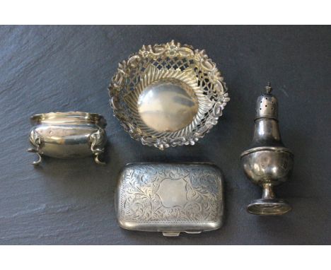 A silver pierced bon bon dish, along with a silver salt, silver pepper and a silver cigarette case  