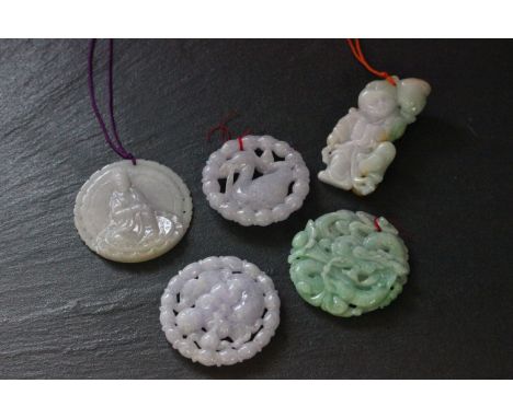 Five Oriental hardstone/ Jade pendants with various carvings to include a Dragon, Buddah etc