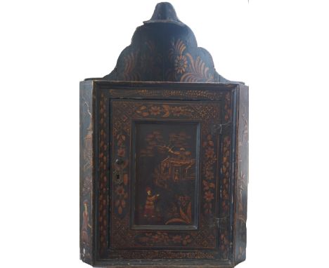 An 18th Century chinoiserie decorated black lacquered hanging corner cupboard
The tapered raised upper section with small she