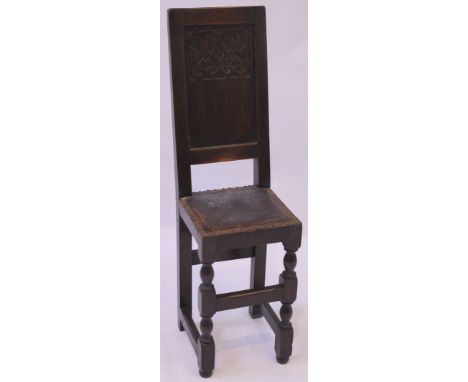 A 17th Century Revival oak child's correction chair, circa 1920s
Bears trade label for J Hunter & Co Ltd, 16, 18 & 28 St Mary