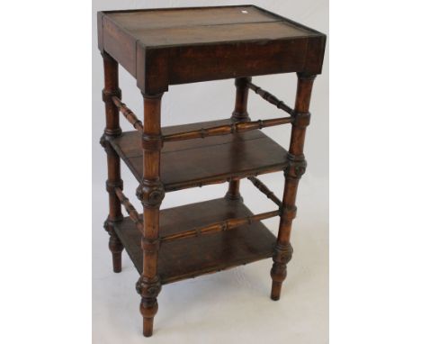 A Victorian oak three tier whatnot
With carved and bobbin turned uprights and corresponding stretchers, width approx 44cm.