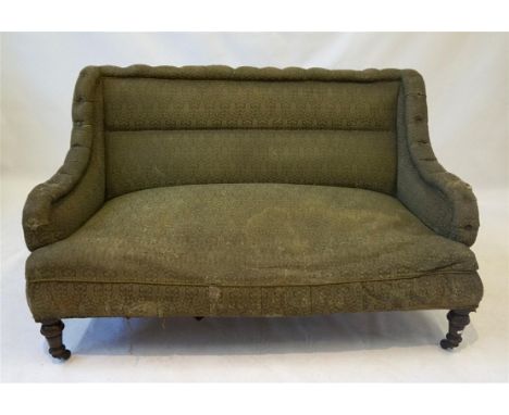 A late Victorian two-seater sofa
The original Liberty-style fabric in poor condition, raised on front turned tapering cylindr