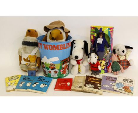 A selection of TV, film and cartoon
related items including Magic Roundabout annuals figures etc, two Wombles figures, wastep