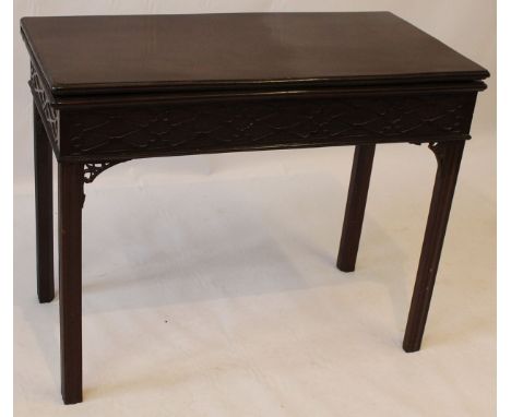 A 'Chinese-Chippendale' revival mahogany card table, 19th Century
The rectangular hinged lid with pretty textile lining, and 