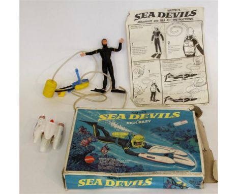 A boxed Mattel Sea Devils set
With Rick Riley comprising Aquanaut and Sea Jet. (illustrated)