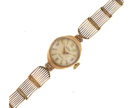 Rotary - Lady's 9ct gold cocktail watch, the silvered dial with applied gilt triangular and quarter Arabic hour markers, 21 j