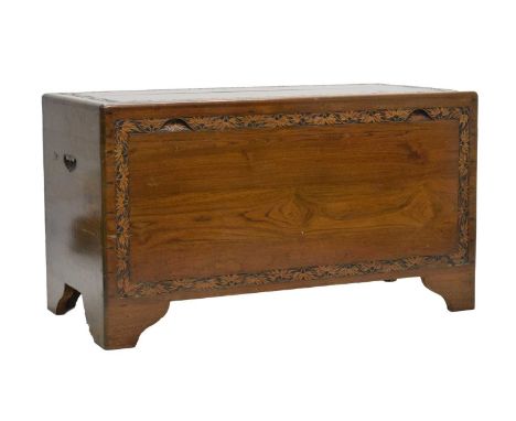 20th century Chinese camphor wood trunk with carved foliate leaf decoration, raised on bracket feet, 101cm x 50cm x 56.5cm hi