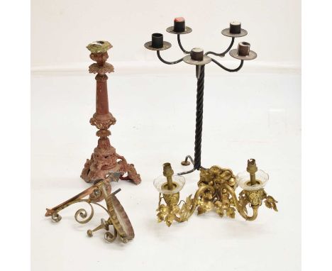 Red painted cast metal candlestick with foliate scroll base, together with a twist metal five branch candelabra, gilt metal t