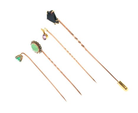 Four gem-set stick pins, one stamped '9ct, and one stamped '15ct', 5.1g gross approx (4)