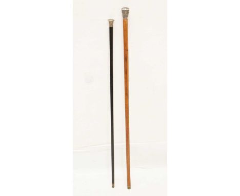 Early 20th century silver topped swagger stick, together with a white metal topped walking cane with embossed Middle Eastern-