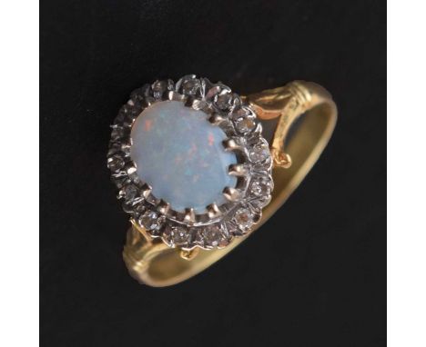 Opal and diamond 18ct gold  cluster ring, size T approx, London 1974, 4.3g gross approx