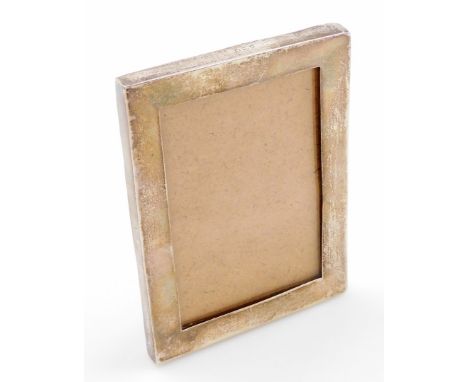 A George V silver easel backed photo frame, of plain design with later backing board, London 1930, 13cm x 9cm.