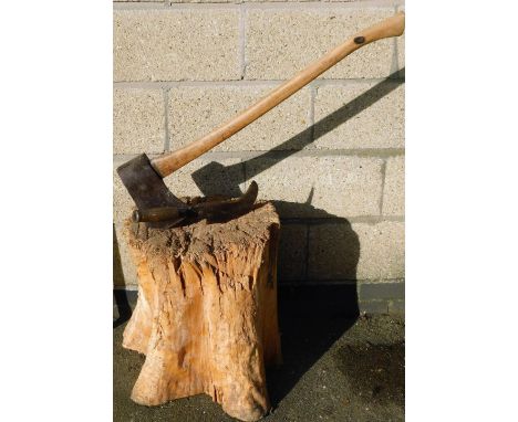 A log splitting axe and an Elwell stamped hatchet, on block stump.