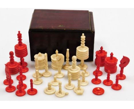 A bone chess set, in a red stained hardwood box. 