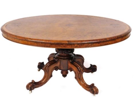 A fine Victorian burr walnut and marquetry breakfast table, with cross banded oval quarter veneered tilt top, and a jewel car
